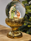 GLOBO DE NEVE COM SAGRADA FAMÍLIA DOURADO LUZ E MOVIMENTO 26,5CM